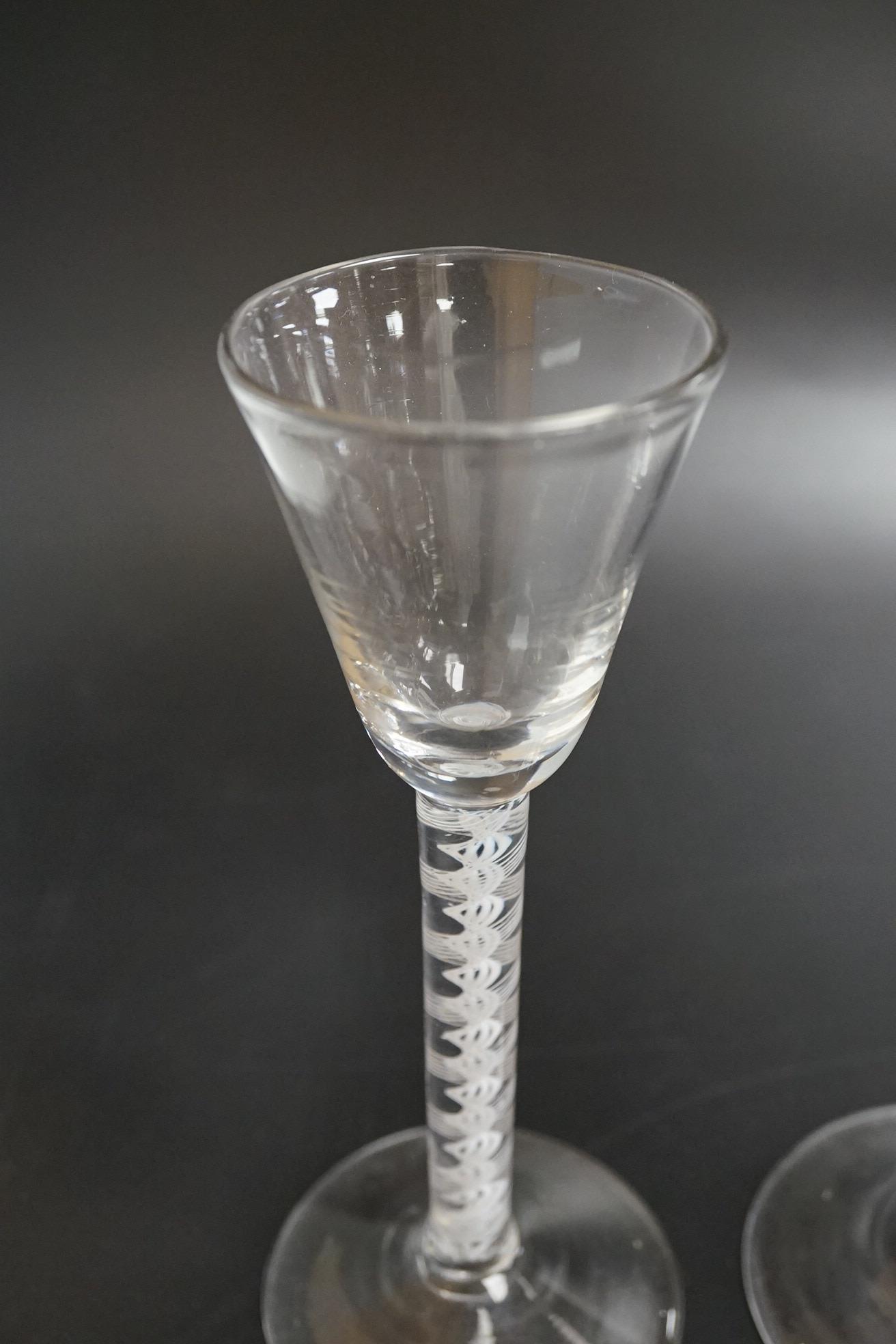 Two DSOT stem wine glasses, c.1760, with funnel shaped bowls, tallest 16.5cm high